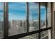 Expansive city view from the window featuring brick buildings, trees, and blue sky above at 800 N Pearl St # 702, Denver, CO 80203