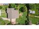 Aerial view showcases a well-maintained home with a spacious backyard and lush greenery at 871 S Worchester St, Aurora, CO 80012