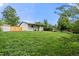 Spacious backyard with healthy lawn, shed, and an inviting covered patio perfect for relaxing outdoors at 871 S Worchester St, Aurora, CO 80012