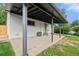 Open patio extends from the backyard, providing ample space for outdoor entertaining at 871 S Worchester St, Aurora, CO 80012