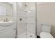 Modern bathroom featuring walk-in shower with glass doors, sleek sink and updated fixtures at 871 S Worchester St, Aurora, CO 80012