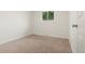 Inviting bedroom filled with natural light from a bright window; fresh neutral paint at 871 S Worchester St, Aurora, CO 80012