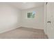 Cozy bedroom with plush carpet and a bright window offering natural light at 871 S Worchester St, Aurora, CO 80012
