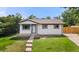 Charming home featuring a well-maintained lawn, freshly painted exterior, and beautiful curb appeal at 871 S Worchester St, Aurora, CO 80012