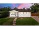 Charming single-story home boasts a well-manicured lawn and freshly painted exterior at 871 S Worchester St, Aurora, CO 80012