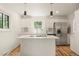 Contemporary kitchen with stainless steel appliances, a kitchen island, and ample cabinet space at 871 S Worchester St, Aurora, CO 80012
