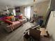 Neutral living room featuring wood-look floors, lots of natural light, and unique decor at 17190 Mt Vernon Rd # 15, Golden, CO 80401