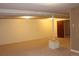 Large basement with carpet flooring, paneled walls, drop ceiling, and a support column at 10759 Ogden St, Northglenn, CO 80233