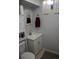 This cozy bathroom features a toilet, vanity, medicine cabinet, and a window for natural light at 10759 Ogden St, Northglenn, CO 80233
