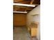 Unfinished garage with exposed rafters and wood workbench at 10759 Ogden St, Northglenn, CO 80233
