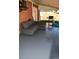Covered back patio with concrete floor, sofa and a grill at 10759 Ogden St, Northglenn, CO 80233