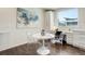 Bright dining area features stylish chairs, hardwood floors, and adjacent workspace at 9180 E 52Nd Dr, Denver, CO 80238