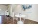 Bright dining area with clear chairs, hardwood floors, and modern decor at 9180 E 52Nd Dr, Denver, CO 80238