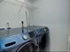 Well-equipped laundry area with modern blue Samsung washer and dryer units at 9180 E 52Nd Dr, Denver, CO 80238