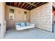 Cozy porch with a relaxing swing, perfect for enjoying outdoor moments at 9180 E 52Nd Dr, Denver, CO 80238