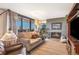 Comfortable living room with a cozy fireplace and access to the outdoor balcony at 4570 E Yale Ave # 1004, Denver, CO 80222