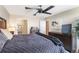 This main bedroom features a ceiling fan, an ensuite bathroom and is stylishly decorated at 4570 E Yale Ave # 1004, Denver, CO 80222