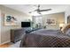 This elegantly styled bedroom features a modern ceiling fan and tasteful decor at 4570 E Yale Ave # 1004, Denver, CO 80222