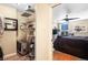 An organized walk-in closet leading into a luxurious bedroom at 4570 E Yale Ave # 1004, Denver, CO 80222