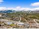 Picturesque aerial view of mountain homes nestled among trees with snow-covered mountains in the background at 10 River Park Dr # A, Breckenridge, CO 80424