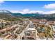 Panoramic aerial view of a charming mountain town with a pond and surrounding green landscape at 10 River Park Dr # A, Breckenridge, CO 80424