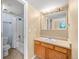 Bathroom with neutral walls, wood cabinets and a shower over tub at 10 River Park Dr # A, Breckenridge, CO 80424