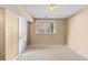 Bedroom with neutral walls, carpet and a large window with views at 10 River Park Dr # A, Breckenridge, CO 80424
