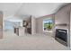 Open floor plan with spacious living room, gas fireplace and kitchen with breakfast bar at 10 River Park Dr # A, Breckenridge, CO 80424