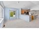 Bright living space with a breakfast bar, corner window, and access to a deck offering mountain views at 10 River Park Dr # A, Breckenridge, CO 80424