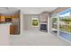 Cozy living area with a fireplace, sliding glass doors to a deck, and an adjacent kitchen at 10 River Park Dr # A, Breckenridge, CO 80424