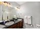 Bathroom with double vanity, shower, and plenty of storage at 12844 King St, Broomfield, CO 80020