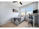 Bright bedroom with a built-in desk and large windows at 12844 King St, Broomfield, CO 80020