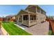 Charming two-story home with a lush green lawn, perfect for outdoor activities and relaxation at 16321 Clayton St, Thornton, CO 80602