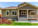 Well-maintained backyard showcasing a covered patio and manicured landscaping at 16321 Clayton St, Thornton, CO 80602