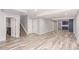 Spacious finished basement features bright walls and laminate flooring at 16321 Clayton St, Thornton, CO 80602