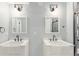 Bathroom featuring double vanity with modern finishes at 16321 Clayton St, Thornton, CO 80602