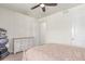 Bright bedroom with neutral walls, a decorative dresser, and a plush bed at 16321 Clayton St, Thornton, CO 80602