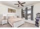 Charming bedroom features a ceiling fan, neutral decor, and cozy furnishings at 16321 Clayton St, Thornton, CO 80602