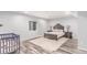 Finished basement bedroom featuring laminate flooring and a large window at 16321 Clayton St, Thornton, CO 80602