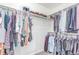 Spacious walk-in closet with ample shelving and hanging space for organized storage at 16321 Clayton St, Thornton, CO 80602