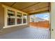 Inviting covered patio overlooking a serene backyard, offering a peaceful retreat at 16321 Clayton St, Thornton, CO 80602