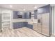 Bright kitchen features ample storage with stainless steel appliances at 16321 Clayton St, Thornton, CO 80602