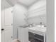 Efficient laundry room featuring modern washer and dryer, maximizing convenience for everyday chores at 16321 Clayton St, Thornton, CO 80602