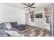Comfortable living room with modern furnishings, wood floors, and a mounted TV at 16321 Clayton St, Thornton, CO 80602