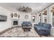 Cozy living room with a fireplace, stylish decor, and comfortable seating at 16321 Clayton St, Thornton, CO 80602