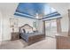 The main bedroom features a decorative tray ceiling and neutral decor at 16321 Clayton St, Thornton, CO 80602