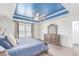 The main bedroom features a ceiling fan, large windows, and dresser at 16321 Clayton St, Thornton, CO 80602