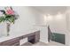 Office nook with a marble countertop, built in cabinetry, and modern stairway access at 16321 Clayton St, Thornton, CO 80602