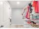 Bright walk-in closet with shelves and rods, providing ample storage space for an organized wardrobe at 16321 Clayton St, Thornton, CO 80602
