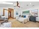 Spacious main bedroom featuring a skylight, ceiling fan and carpet flooring at 2424 S Steele St, Denver, CO 80210